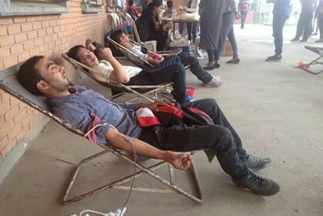 Donors giving blood at the Gongabu camp