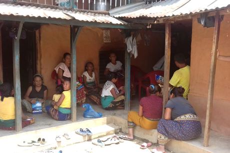 Farmers gathered at a house during the programme