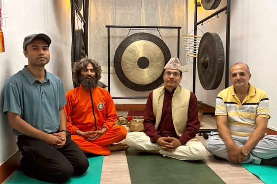 Yogi Ji seated with officials and guests after a session in Kathmandu