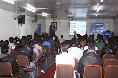 A trainer addressing the participants during the session