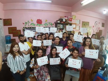 Participants holding their certificates at the end of the 2023 beautician training, Kathmandu