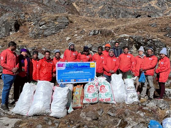 The New Vision Nepal team with waste collected at Gosaikunda, Rasuwa
